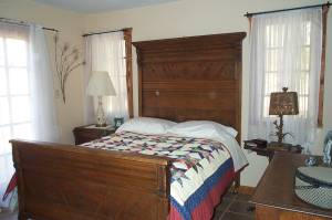 The cottage bedroom. French doors on left.